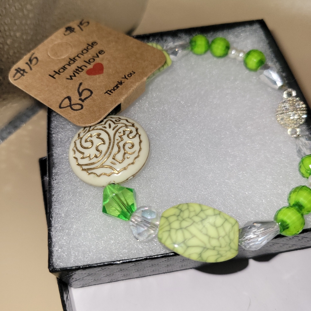 8.5 in. Hand crafted green and cream colored beaded bracelt